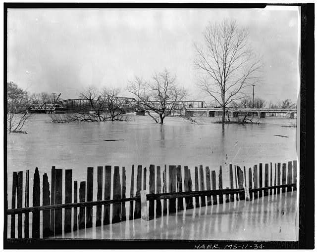 34.  BRIDGE, CONSTRUCTION MISSISSIPPI, LOWNDES CO. COLUMBUS End of Main St., Columbus Date: 1925-27. Old bridge in background. Photo taken from such (probably east) bank. Credit: Shenks Photography, Columbus, Ms, owner. O. Pruitt, photographer, ca. 1927. Copied by Sarcone Photography, Columbus, Ms. Sep 1978. - Bridges of the Upper Tombigbee River Valley, Columbus, Lowndes County, MS