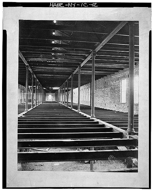 12.  Photograph of a photograph in possession of the Watervliet Arsenal Museum, New York. CONSTRUCTION PHOTOGRAPH SHOWING CAST IRON COLUMNS AND BEAMS IN WHAT IS PROBABLY THE SECOND FLOOR OF UNIT 2. TAKEN IN 1865. - Watervliet Arsenal, Building No. 40, Broadway between Dalliba & Watervliet Avenues, Watervliet, Albany County, NY
