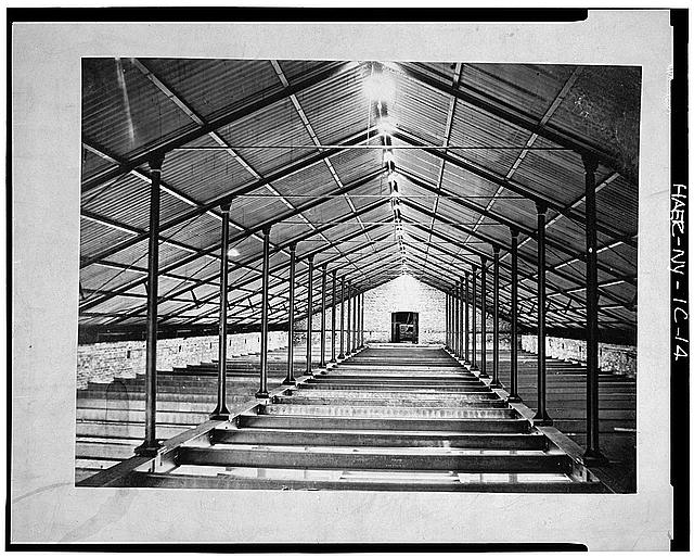 14.  Photograph of a photograph in possession of the Watervliet Arsenal Museum, New York. CONSTRUCTION PHOTOGRAPH SHOWING CAST IRON TRUSS SYSTEM IN WHAT IS PROBABLY UNIT 2. TAKEN IN 1865. - Watervliet Arsenal, Building No. 40, Broadway between Dalliba & Watervliet Avenues, Watervliet, Albany County, NY