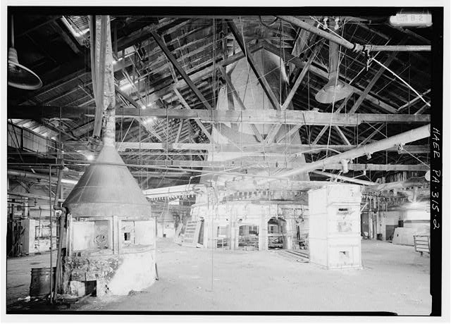 FURNACE NO. 1, THE ORIGINAL FURNACE OF THE GLASS FACTORY; TO THE LEFT IS A GLORY HOLE, POSSIBLY DATING FROM THE NINETEENTH CENTURY; THE SQUARE-SHAPED GLORY HOLE TO THE RIGHT PROBABLY DATES FROM THE 1950S. - Westmoreland Glass Company, Seventh & Kier Streets, Grapeville, Westmoreland County, PA
