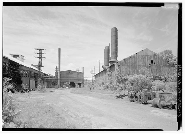 General view of complex from NE corner, looking west.  Probably gas producing buildings at right. - Phoenix Iron Company, Rolling Mill, North of French Creek, west of Fairview Avenue, Phoenixville, Chester County, PA